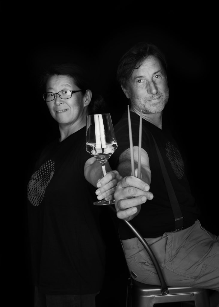 Black-and-white portrait of winemaker Christophe Mittnacht and his wife Yuka, a Tokyo chef, founders of Terres d'Étoiles.